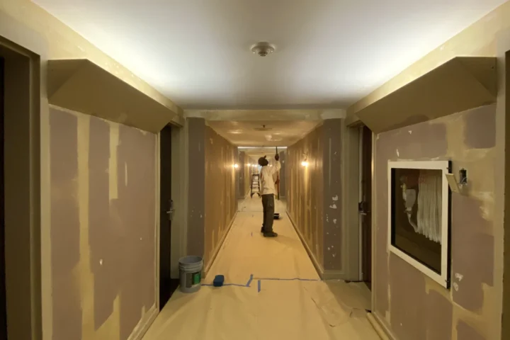 Corridor walls and floor protected during work