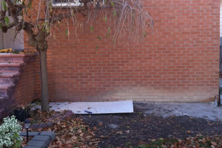 Exterior wall before new entrance steps