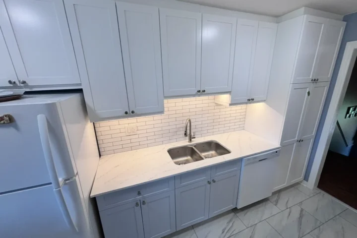 White kitchen cabinetry and tiled backsplash