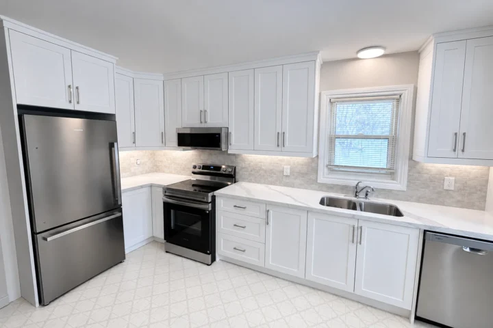 Renovated white kitchen with stainless steel appliances