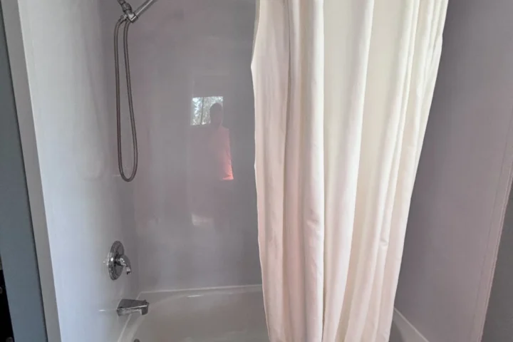 Original tub and curtain before shower renovation