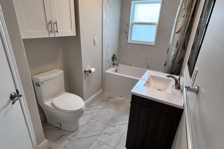Completed bathroom vanity, flooring and fixtures