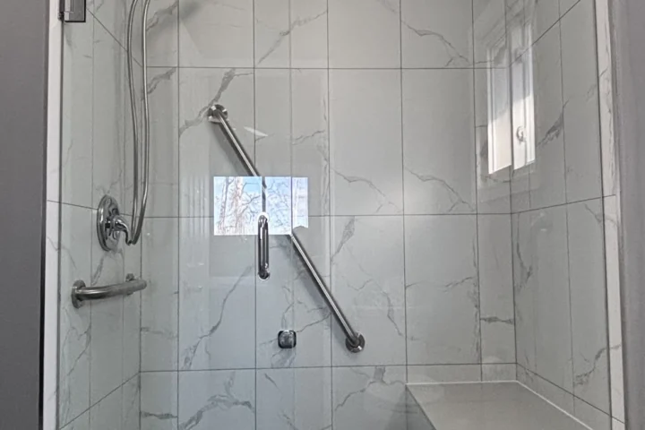Completed glass shower with tiled walls